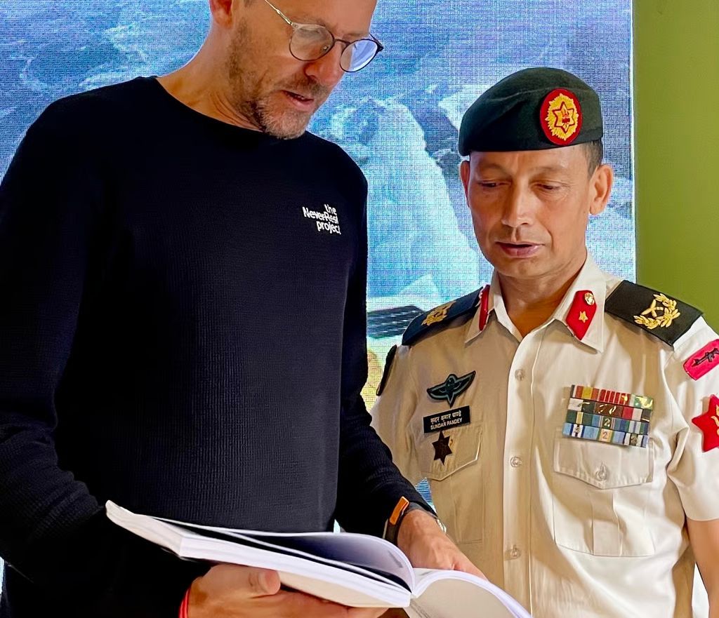 Frédéric Kauffmann reviewing a document during a meeting